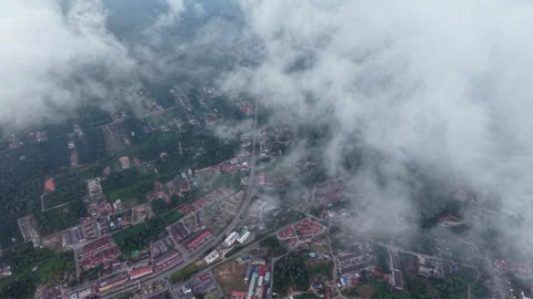 Clouds drift over quiet town Видео 332599148