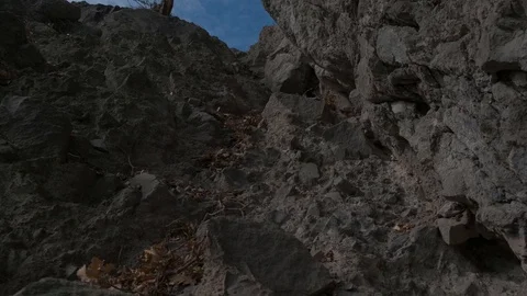 Clouds drift over rock formations Stock Footage 124807834