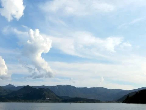 Clouds Drift Over Skadar Lake, Inviting Travelers to Explore Montenegros Beau Stock Photos