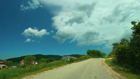 Clouds drift slowly above hills and trees. Sokobanja region, Serbia Stock Footage 338022599