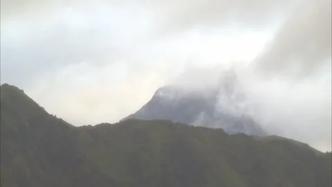 Clouds Drifting Around a Mountain Stock Footage 327823173