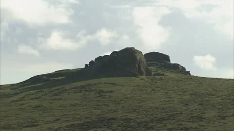 Clouds drifting behind Haytor on Dartmoor Video stock 8906819
