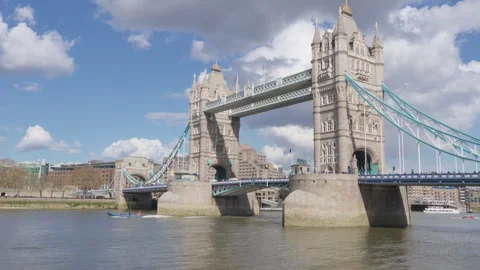 Clouds drifting gracefully over london's iconic Tower Bridge Stock Footage 289013445