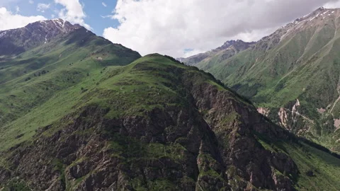 Clouds drifting gracefully over majestic mountain range Stock Footage 289658042