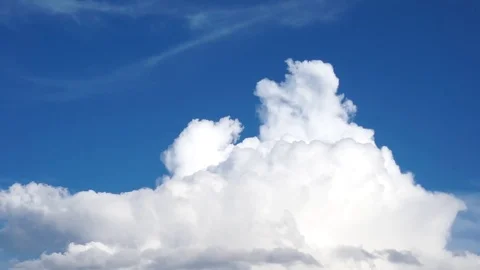 Clouds drifting, melting and growing in clear blue sky Stock Footage 77177430