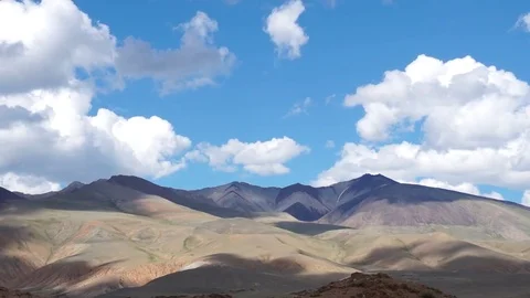 Clouds drifting, melting and growing in clear blue sky Stock Footage 77177501