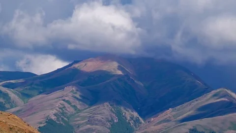 Clouds drifting, melting and growing in clear blue sky Stock Footage 77177516