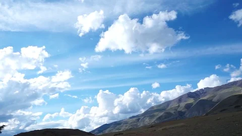 Clouds drifting, melting and growing in clear blue sky Stock Footage 77177531