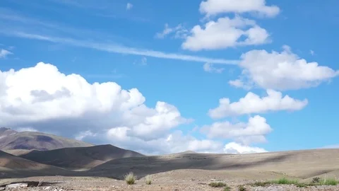 Clouds drifting, melting and growing in clear blue sky Stock Footage 77177547