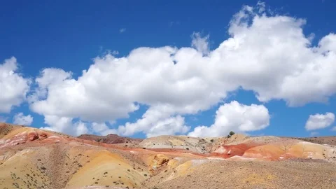 Clouds drifting, melting and growing in clear blue sky Stock Footage 77177599