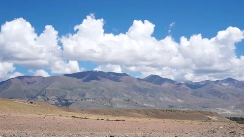 Clouds drifting, melting and growing in clear blue sky Stock Footage 77177604