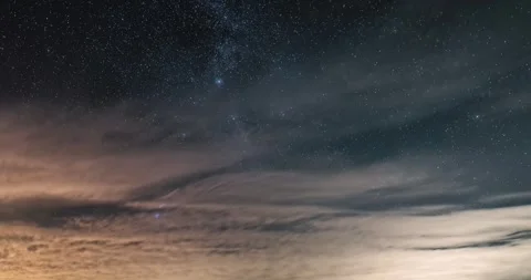 Clouds Drifting in Night Sky and Reveal Milky Way Galaxy, Astronomy Background Stock Footage 323392656