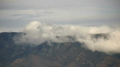 Clouds Drifting over a Mountain Stock Footage 76998