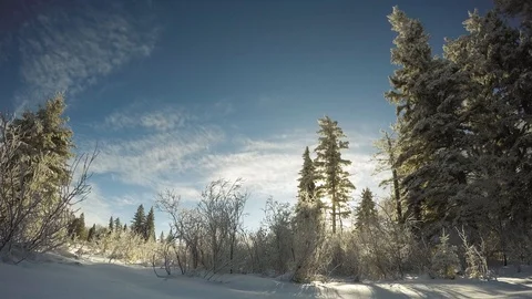 Clouds drifting over snowy scene Stock Footage 98511840