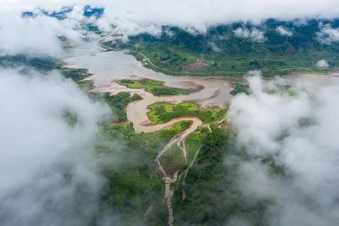 Clouds drifting over winding river and reservoir Stock Photos