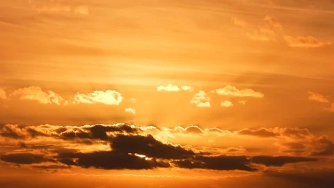 Clouds drifting in warm sunset 動画素材 97444061