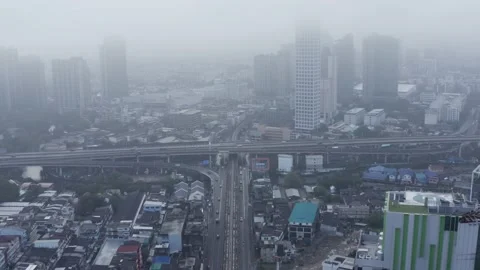Clouds drone birds eye view of BTS skytrain on Sukhumvit street in Bangkok, the Stock-Footage 228804139