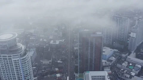 Clouds drone birds eye view of BTS skytrain on Sukhumvit street in Bangkok, the Stock-Footage 228804267