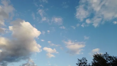 Clouds at dusk turning orange and pink Stock Footage 118617419