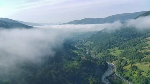Clouds Embrace The Mountains  The Road Calls Into The Distance. Video stock 314978911