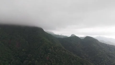 Clouds embracing lush green mountains of koh chang island, thailand Video stock 304312778