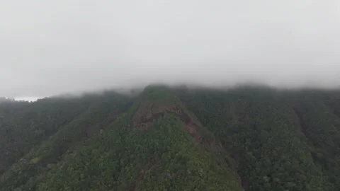 Clouds embracing lush green mountains of koh chang island Video stock 305898756