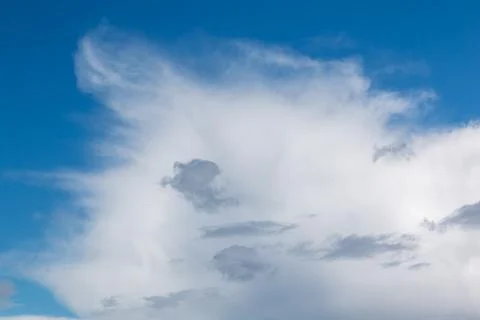 Clouds encroaching upon the blue sky Stock Photos
