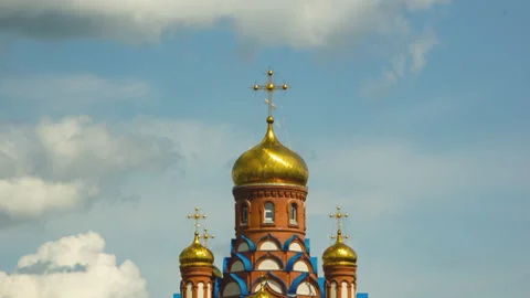 Clouds envelop the domes of the church Stock Footage 246023850