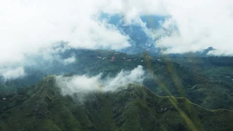 Clouds envelop the mountain slopes Video stock 151955629