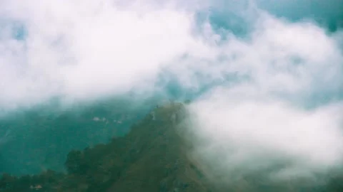 Clouds envelop the mountain slopes Video stock 151957970