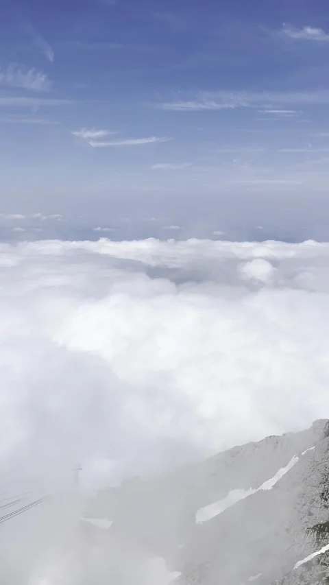 Clouds enveloping the alpine peak of Sntis Stock Footage 306065666
