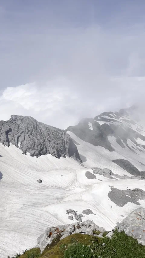 Clouds enveloping the alpine peak of Sntis Stock Footage 306066529