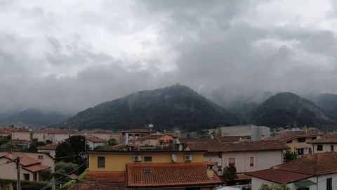 Clouds enveloping the mountains time lapse Stock Footage 128819857