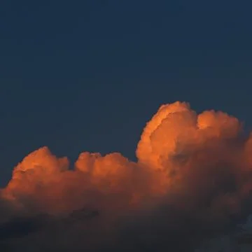 Clouds in the evening sky illuminated by the sun has sat down for horizon. Stock Photos