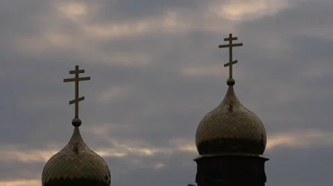 Clouds in evening before sunset and 2 orthodox church domes Stock Footage 46238502