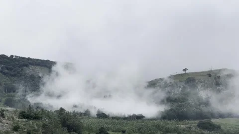 Clouds Falling Like Water Over a Mountain Stock Footage 289385109
