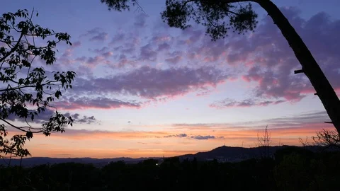 Clouds fast fly at sunset sky over Barcelona, timelapse Stock Footage 102892246
