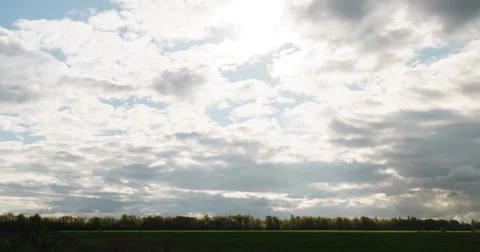 Clouds fast move over field and disappear Stock Footage 63251817