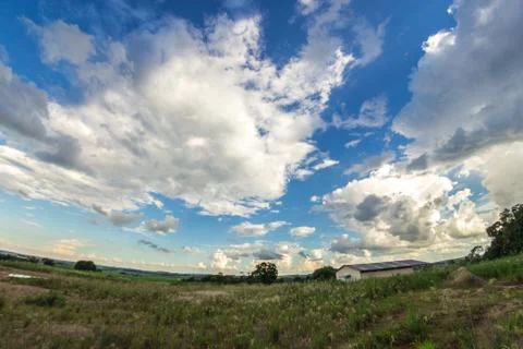 Clouds in the field Stock Photos