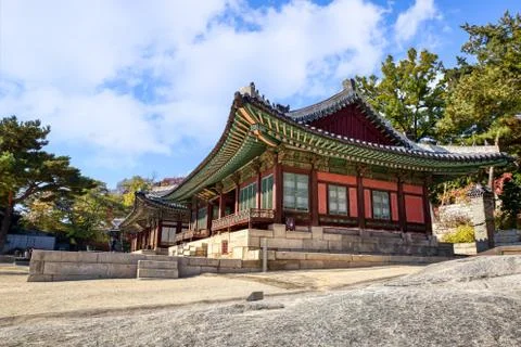 Clouds fill the sky in the backdrop of this artistic building of the Changgyo Stock Photos