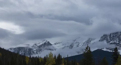 Clouds first snow mountains Yoho National Park late fall early winter rockies Vídeo Stock 289588444