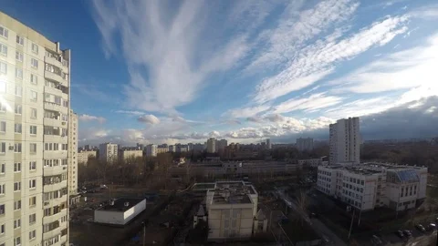 Clouds float above city district timelapse Stock Footage 77285141
