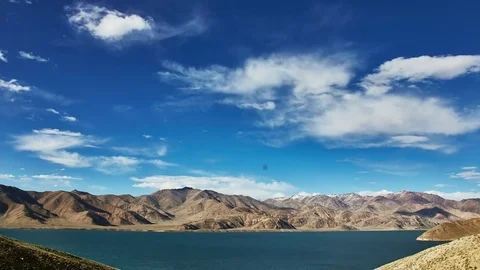 Clouds float above the mountain lake. Time lapse. Pamir highway. Tajikistan Stock Footage 70894092