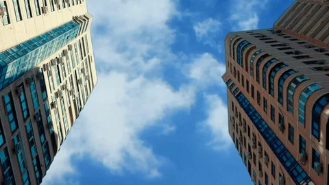 Clouds float above the skyscrapers. Zoom out. Stock Footage 112059207