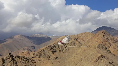 Clouds float above the Tibetan temple in the mountains Stock Footage 96016414