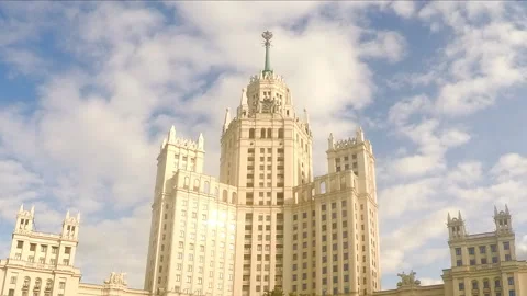 Clouds float above the white stone tower timelapse 스톡 동영상 87231027