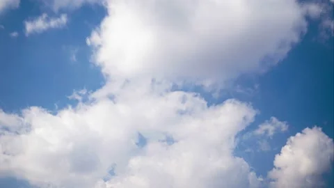 Clouds float Across the blue sky. timelapse Stock Footage 105857872