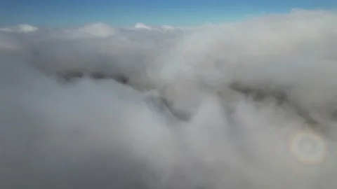 Clouds float across the blue sky i Stock Footage 214799929