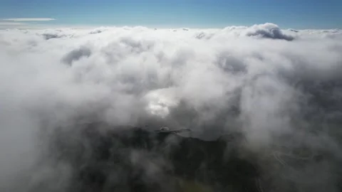 Clouds float across the blue sky i Stock Footage 214800134