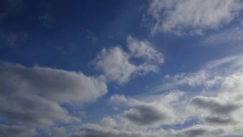 Clouds float across the blue sky. Timelapse Video stock 334059441